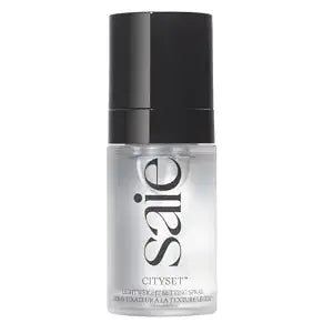 Saie Mini CitySet hydrating setting spray with ultra-fine mist and dewy finish.